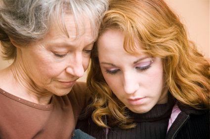 Mother consoling daughter